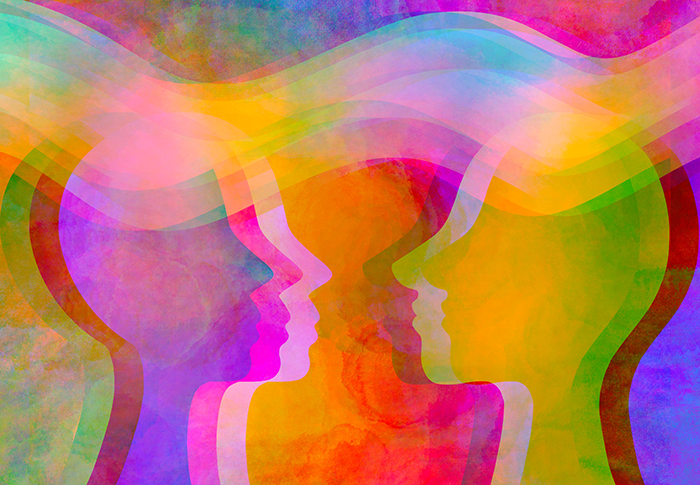 Des silhouettes colorées et translucides se faisant face, créant une ambiance d'harmonie et de connexion.