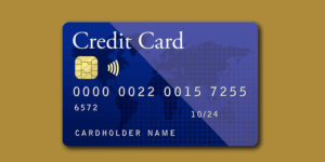 Carte bancaire bleue sur fond doré symbolisant un paiement sécurisé en ligne pour les séances de sexothérapie, de coaching et de Mieux-Être sur juancarlossexotherapie.com